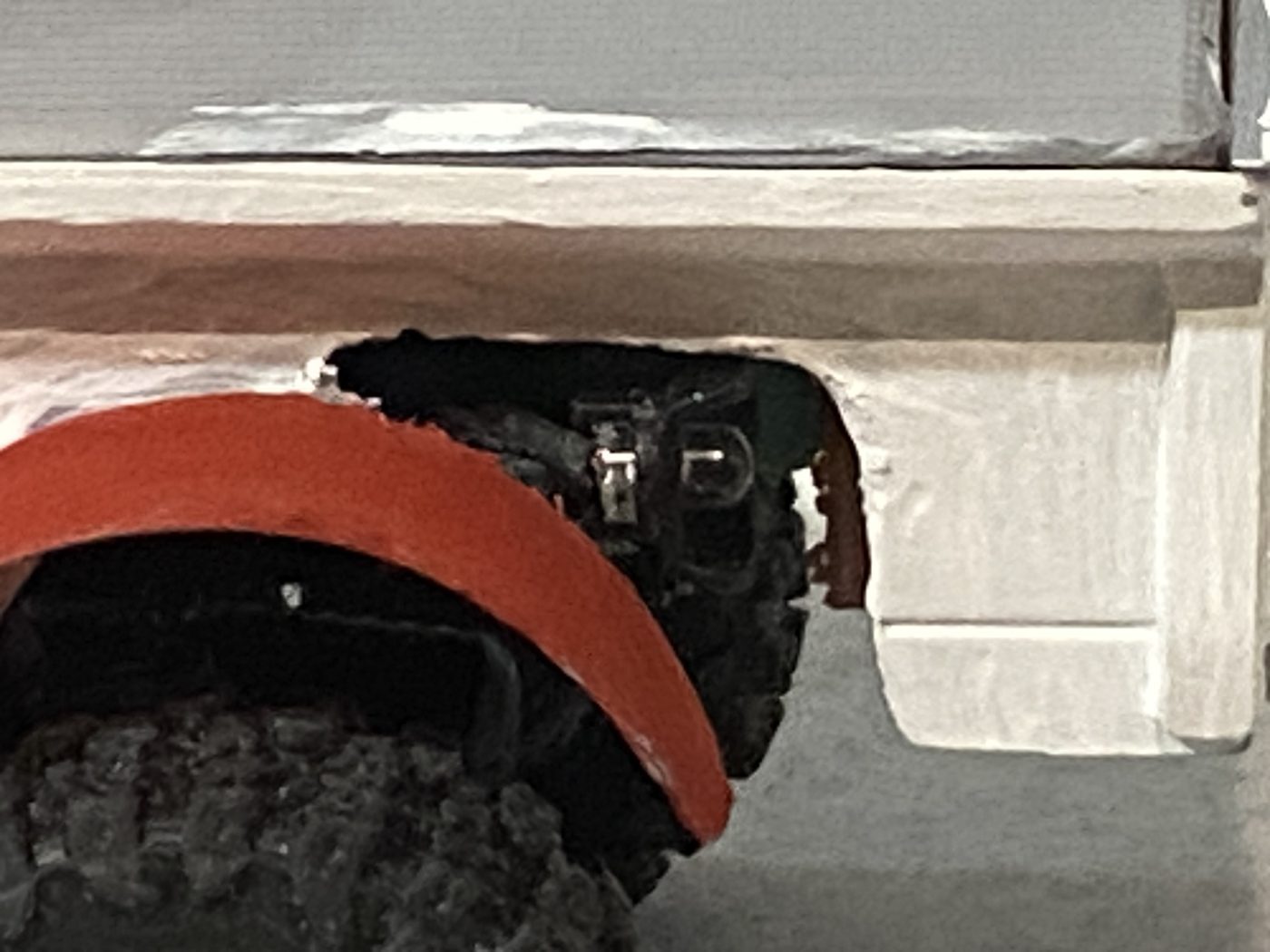 Close view of the rear of a converted body, cut away so the chassis hardware sits in the opening.
